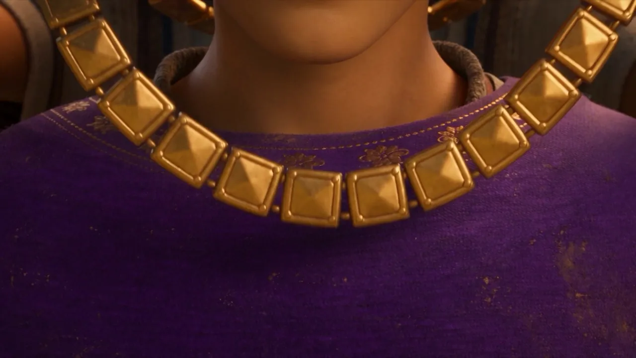 A collar of gold settles around his neck