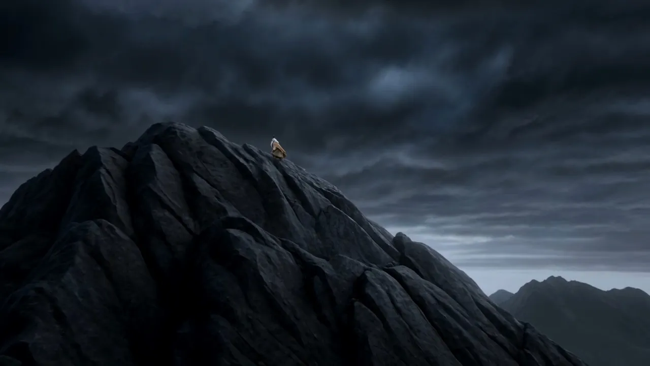 He stands at the summit in the storm and speaks