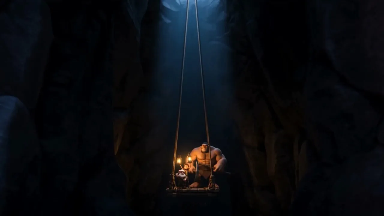 Men descending into the dark with lamps