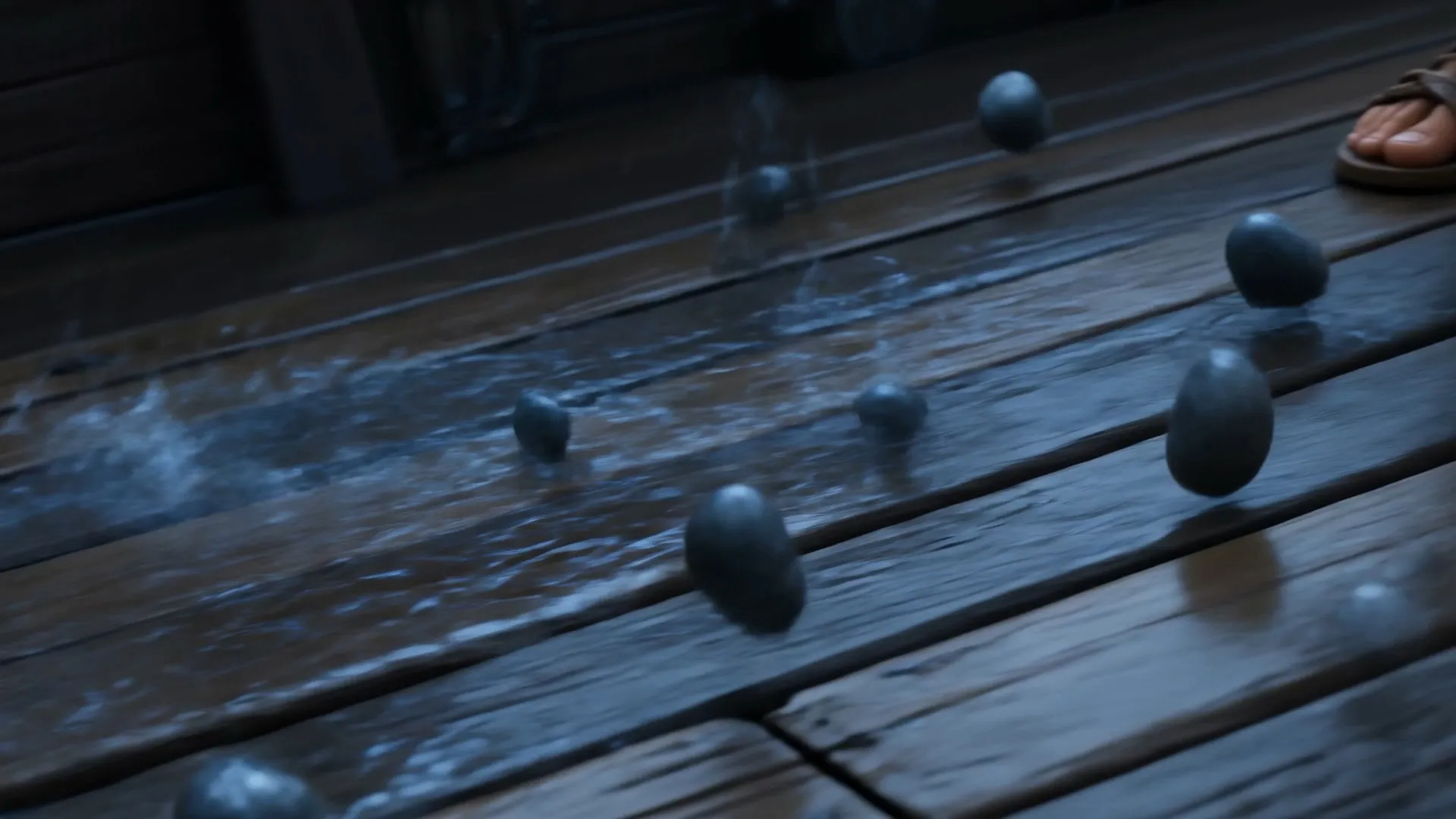 Stones bounce across the wet deck