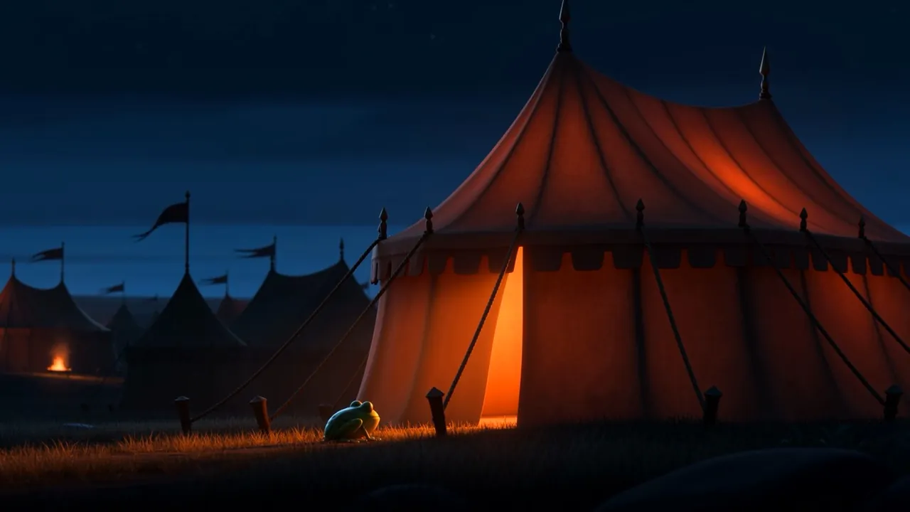 At the foot of the lit flap, in the grass, something small and green is waiting