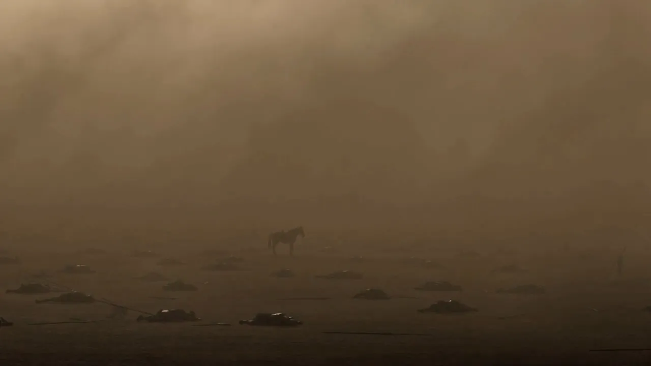 Mist drifts over the empty battlefield