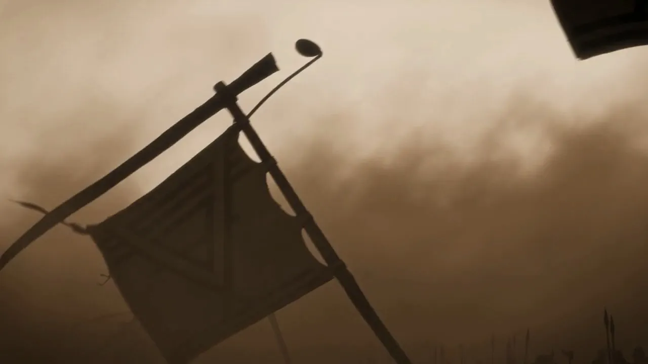 A banner tilts and falls against the dust