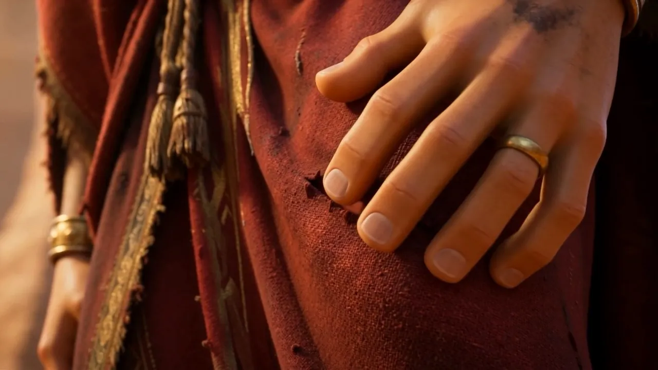 And a hand goes to the torn hem of a robe
